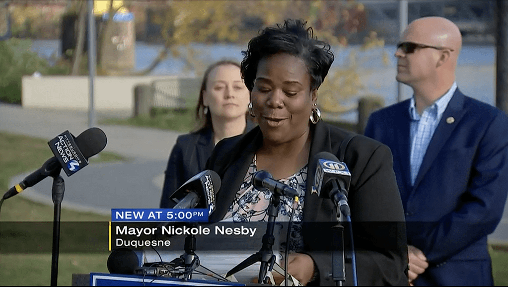 Image description: screen capture from WPXI report of PPT Treasurer Mayor Nickole Nesby speaking at a press conference with County Executive Rich Fitzgerald and State Senator Linsey Williams about what the Infrastructure Bill will do for public transit in Allegheny County.