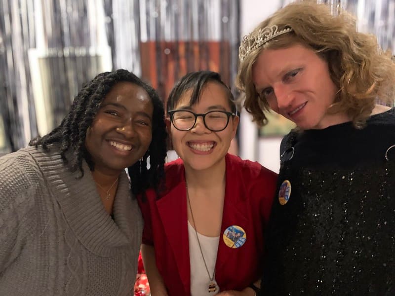 Image Description: PPT Members Tiffany, Bonnie and Gabriel smile for a photo at the year-end membership party.